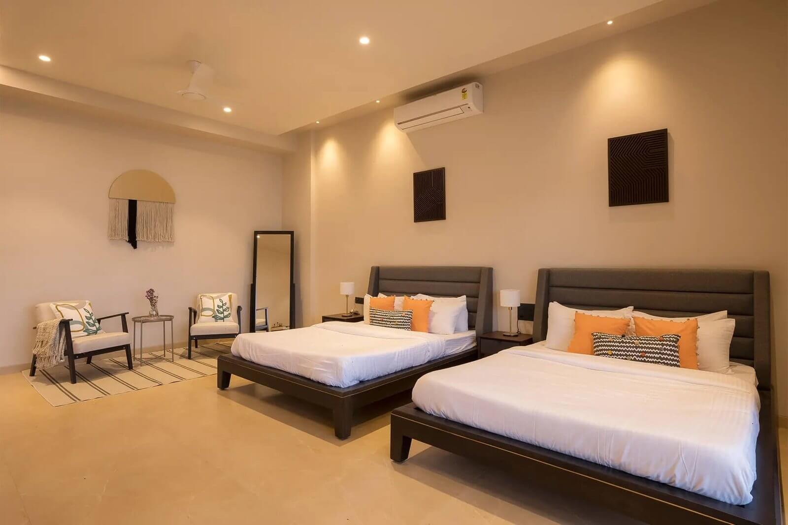 MASTER BEDROOM – Bed dressed, balcony doors open, lake visible beyond.